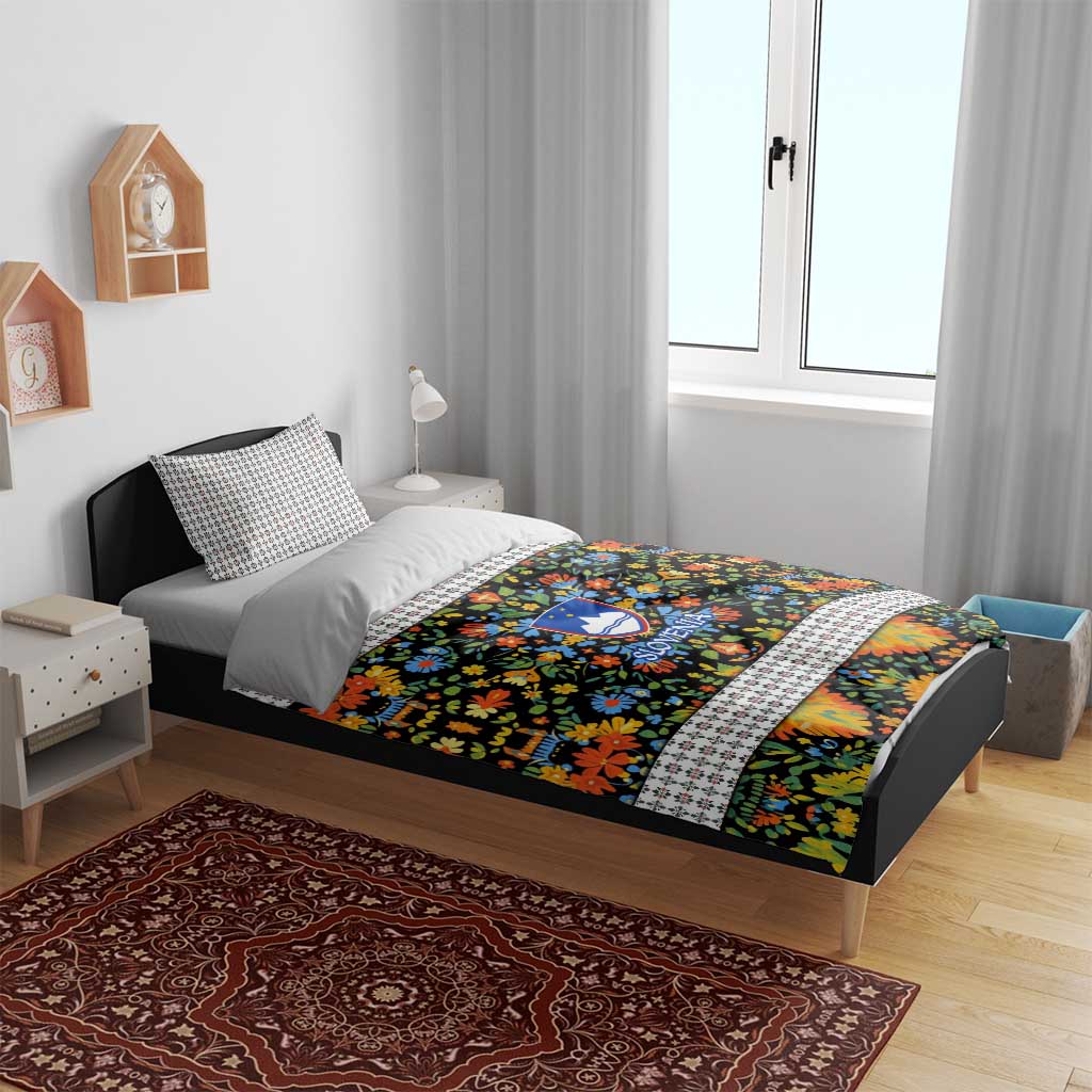 Folk art bedding set on bed with multicolor floral duvet and white geometric pillowcases