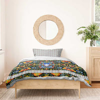 Folk art duvet cover and pillows with multicolor flowers, white trim, and Slovenia crest