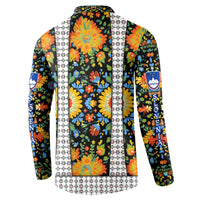 Multicolor floral hoodless sweatshirt with white patterned center panel and blue crest badge.