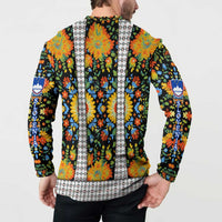 Back view multicolor floral button sweatshirt with vertical white trim and blue crest emblem.