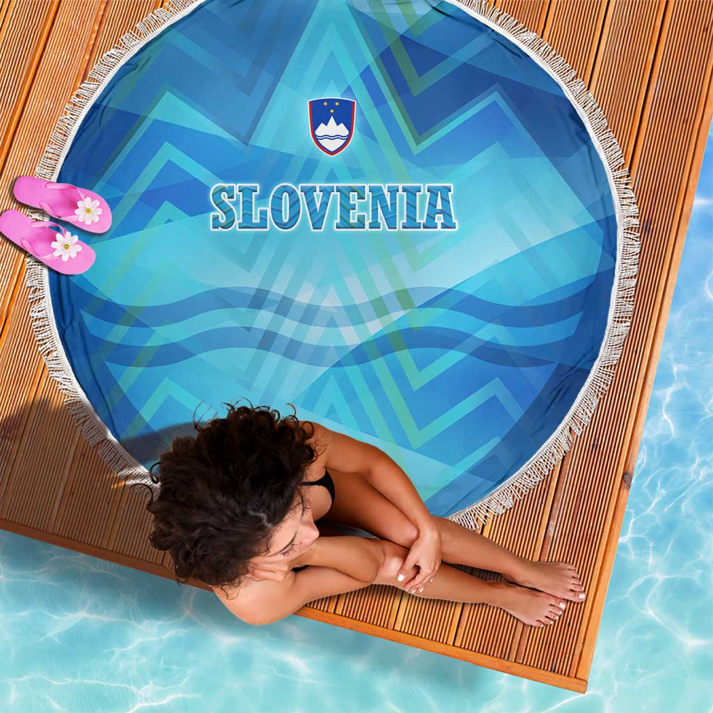 Round blue beach blanket with white fringe, SLOVENIA and crest, alpine geometric design