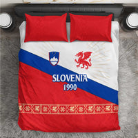 Red, white and blue duvet cover with two red pillows; Slovenia 1990 dragon emblem