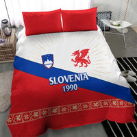 Bedding set with two red pillows and duvet featuring Slovenia 1990 text and dragon emblem