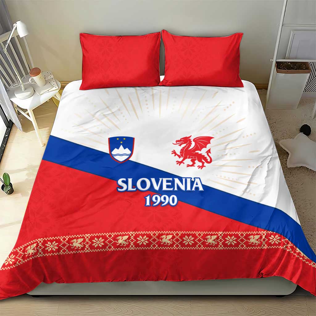 Two red pillows and duvet cover showing Slovenia 1990, dragon emblem, and decorative border