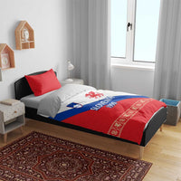 Bedroom bed with duvet featuring Slovenia 1990 dragon emblem in red, blue, and white