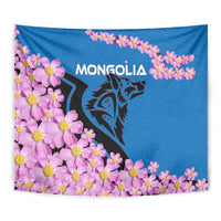 Close-up blue tapestry with pink blossoms, dark wolf head, and 'MONGOLIA' lettering