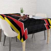 Belgium tablecloth on dining table with black, red, and yellow lightning stripe pattern