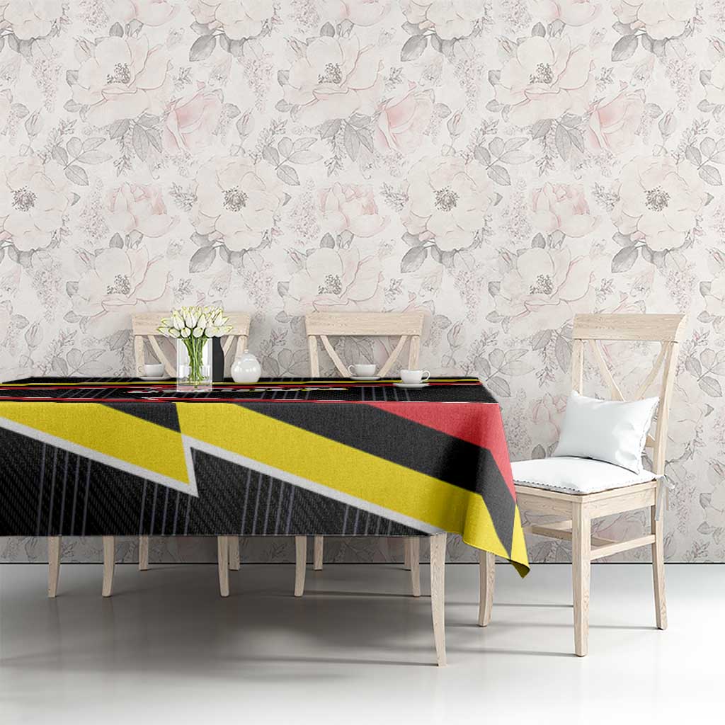 Belgium tablecloth on dining table with black, red, and yellow lightning stripe design