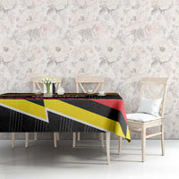 Belgium tablecloth on dining table with black, red, and yellow lightning stripe design