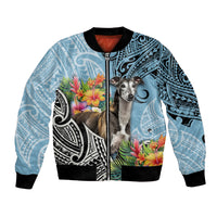 Cyan bomber jacket with black ribbed cuffs and full-zip, greyhound with Polynesian pattern art