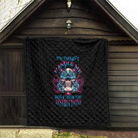 Black quilt with diamond quilting and blue/pink triangle skull graphic, hanging