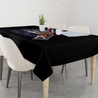 Black triangle tablecloth draped over table with colorful skull print