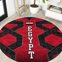Round red and black carpet with large EGYPT letters and geometric star pattern