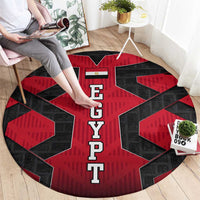 Round red and black EGYPT letter rug with geometric star shapes