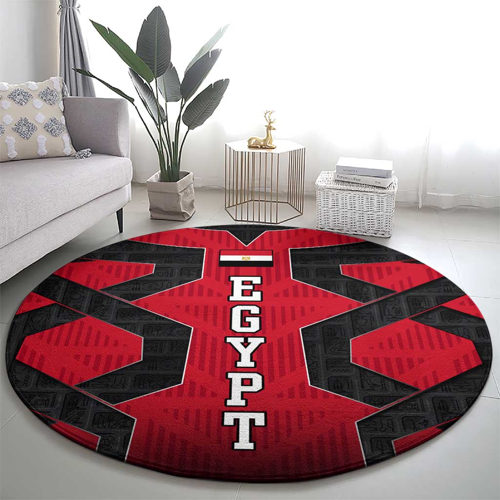 Round red and black EGYPT letter carpet with bold geometric star center