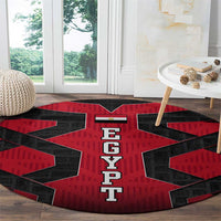 Round red and black carpet with EGYPT letters and star-like black blocks