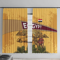 Yellow Egyptian-themed window curtain with pyramids, Anubis, and camel caravan artwork.