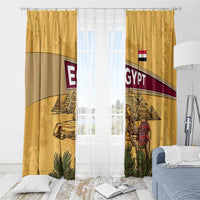 Yellow Egypt window curtains with hanging rings, pyramids, Anubis, and camel caravan graphics.