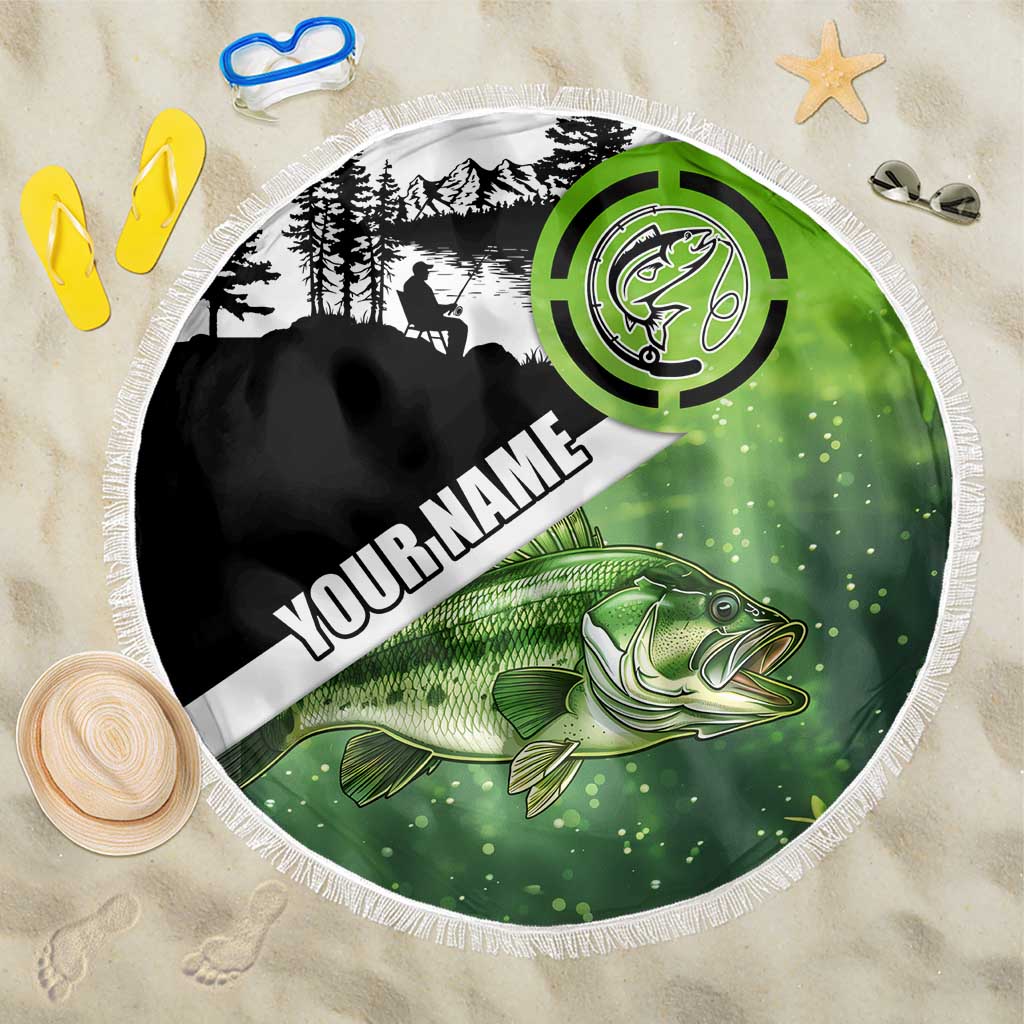 Round green and black fishing beach blanket with fish illustration, emblem, and fringe