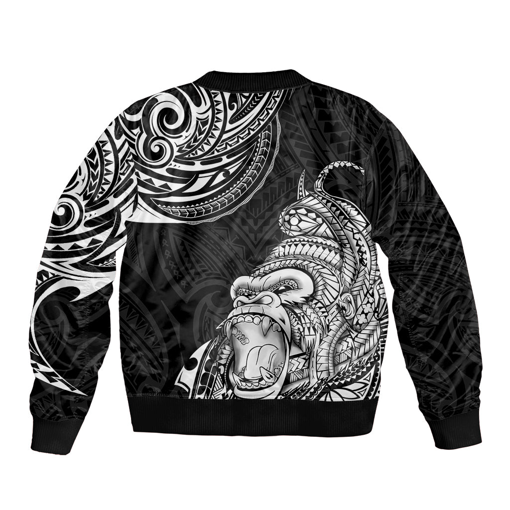 Black bomber jacket with tribal gorilla tattoo graphic on back, ribbed hem