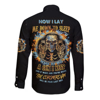 Black long-sleeve button shirt with skull graphic on back.