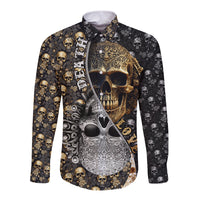 Long sleeve button shirt with black base and gold skull graphic print, front view.