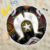 Round beach blanket with Aboriginal-style geometric pattern, black and multicolor accents, fringe edge