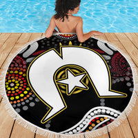 Round Aboriginal pattern beach blanket in black with white star emblem and multicolor dot accents, fringe