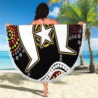 Round beach blanket with Aboriginal-inspired graphic of star and abstract shapes on black, fringed border