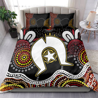 Aboriginal pattern bedding set on bed with multicolor circular motifs, central speech-bubble icon