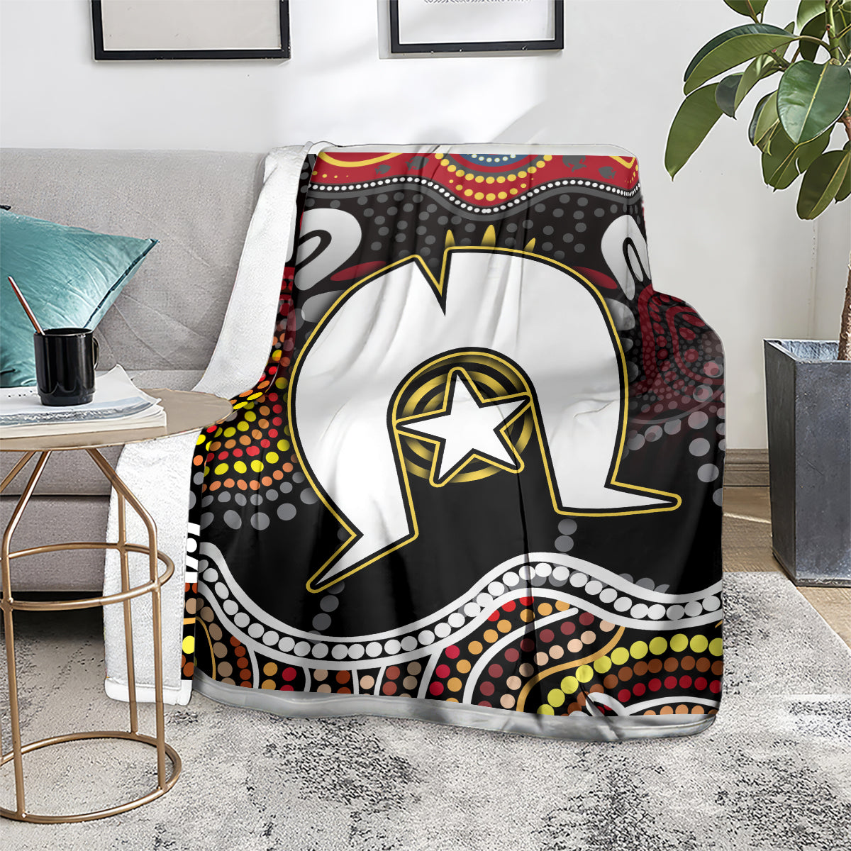 Multicolor Aboriginal pattern blanket on gray armchair with white figure and star emblem
