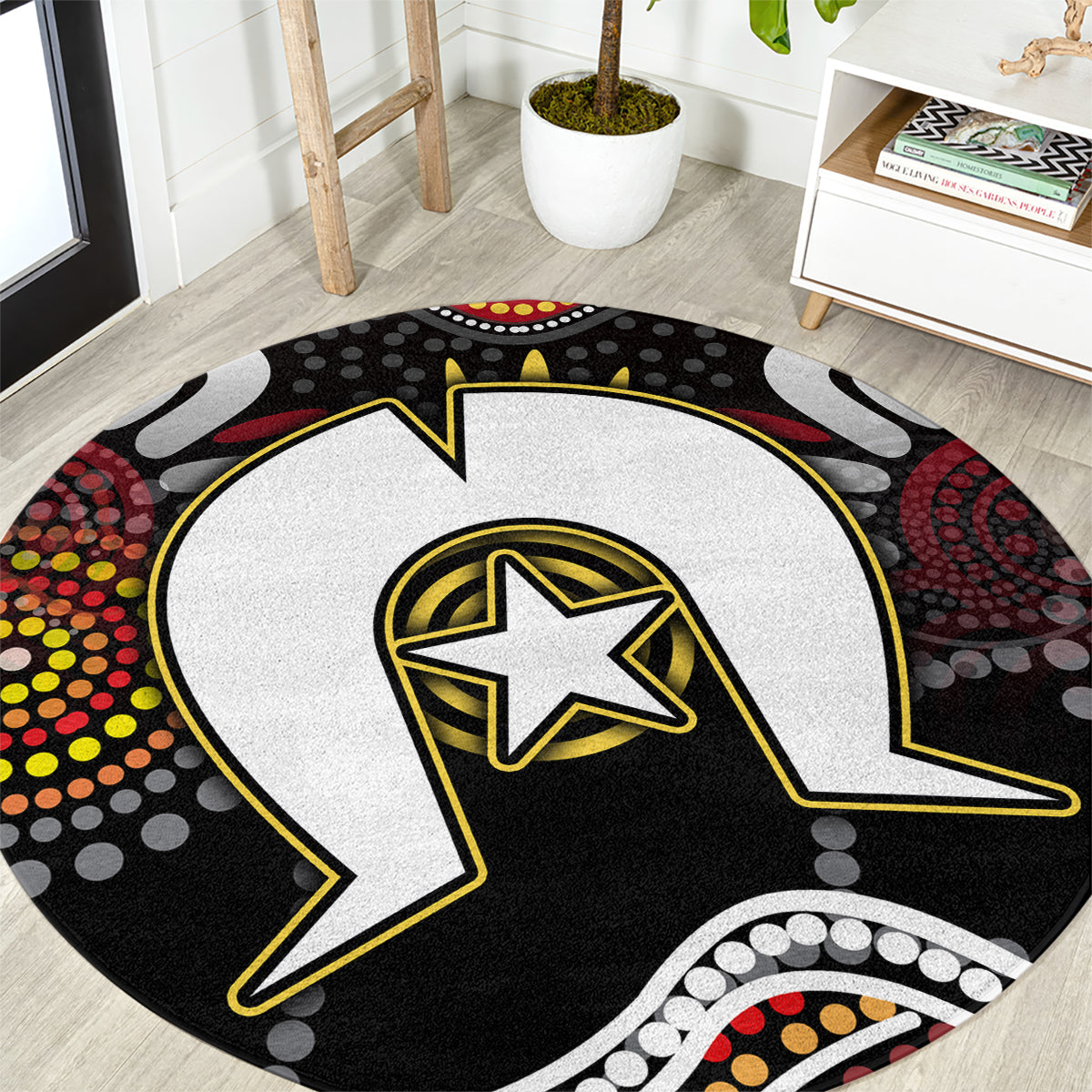 Round Aboriginal pattern rug with black and white lightning bolt and yellow star center.