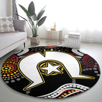 Round Aboriginal pattern rug with black, white, and yellow star lightning artwork and dot accents.