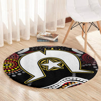 Round Aboriginal pattern rug featuring a black lightning bolt with yellow star and multicolor dot edge.