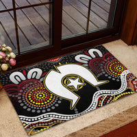 Multicolor Aboriginal pattern doormat on outdoor step with white animal and star emblem