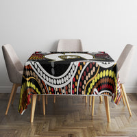 Multicolor aboriginal pattern tablecloth on square dining table with bold yellow and red dots