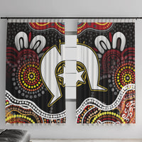 Multicolor window curtain panels with bold Aboriginal-style dot and figure patterns on black base.