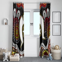 Tall multicolor window curtain panels with bold Aboriginal-style dot and figure designs.