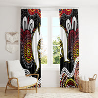 Black-and-multicolor window curtain panels featuring Aboriginal-style dot and figure motifs.