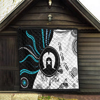Aboriginal Pattern Torest Strait Island quilt TS04 hanging with black, white, and teal artwork