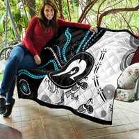 Aboriginal Pattern Torest Strait Island quilt TS04 held outdoors, black, white, and teal print