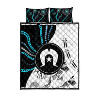Multicolor Aboriginal pattern quilt bed set, straight-on view: quilt with black, white, turquoise motifs