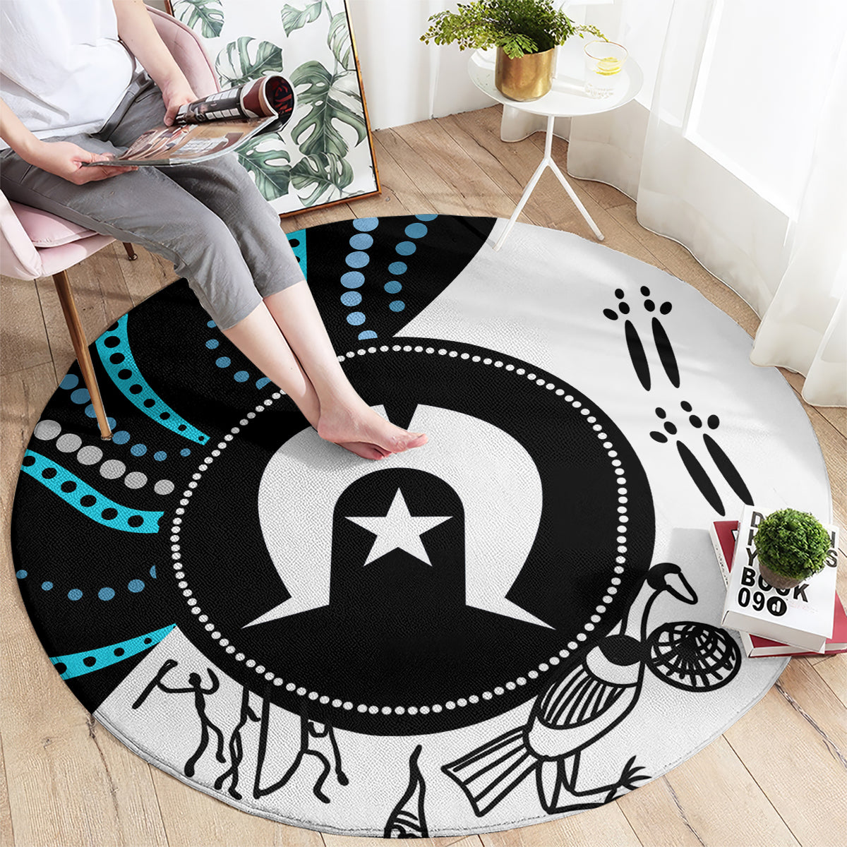 Round carpet laid flat, featuring central star emblem, black and white with teal dots