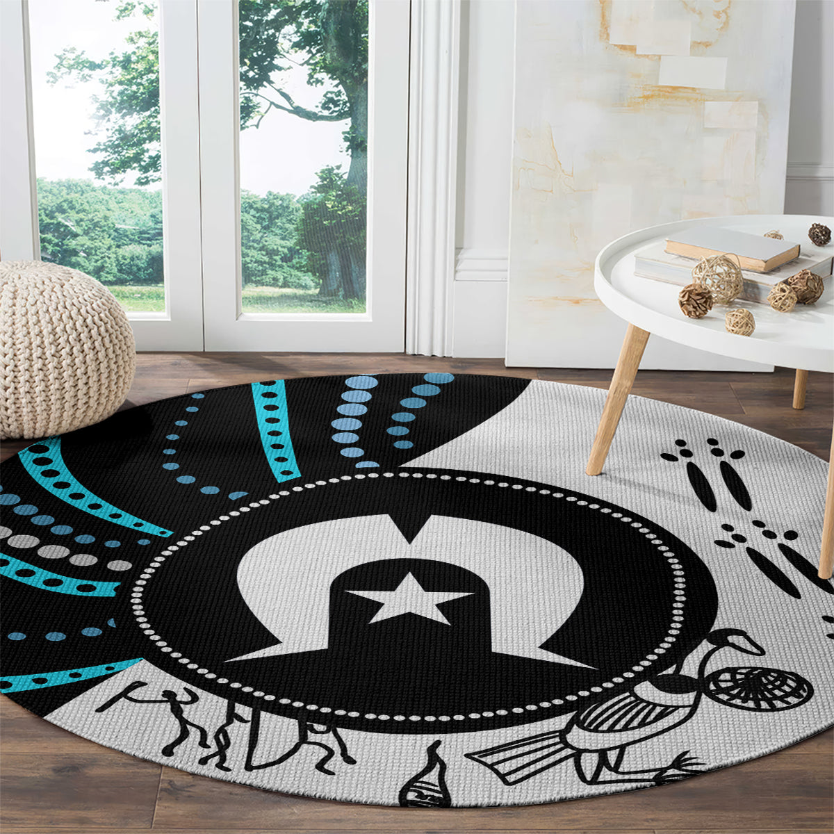 Round aboriginal-style rug with central star medallion and paw-print details, black and teal