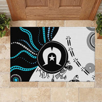 Rectangular rubber doormat with black and white design, blue dot waves, central icon