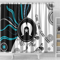 Full shower curtain with Aboriginal pattern: black and white background, turquoise waves, emblem