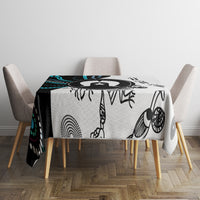 Aboriginal pattern tablecloth on square table with black-and-white tribal icons
