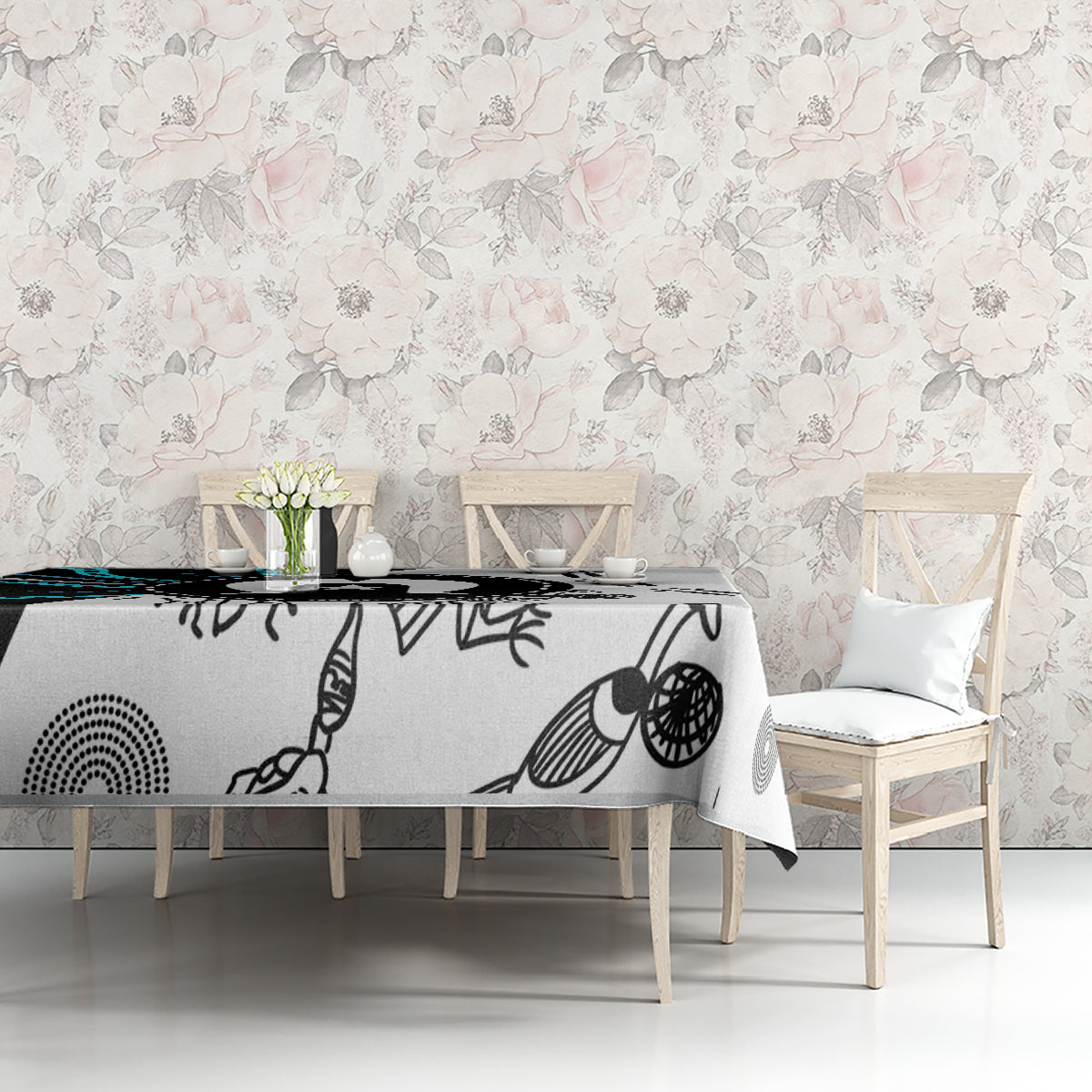 Aboriginal pattern tablecloth on long table with black, white, and teal abstract prints