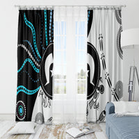 Hanging window curtains with Aboriginal-inspired symbols in black and white with teal accents