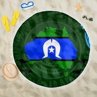 Green round beach blanket with Aboriginal map pattern and white fringe edge